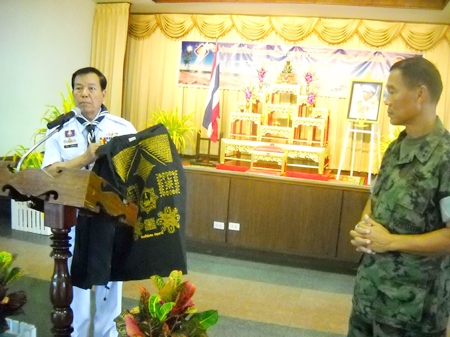 Rear Adm. Samak Noophairoj, scouts club president, presents vests covered in good luck symbols to Marine Corps Training Center commander, Vice Adm. Phongsak Phuririj.